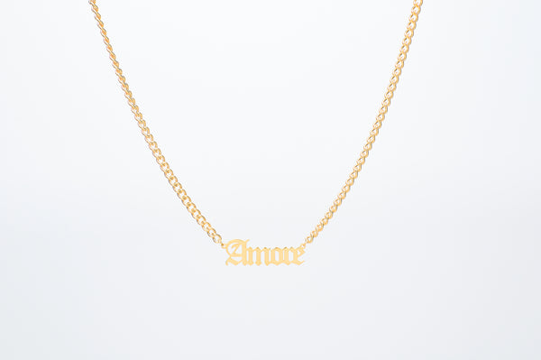 Gothic Font Old English Custom Name Necklace crafted on our chunky Cuban chain. Pendant size: 1-2cm. Made from stainless steel, choose from 18k Gold plated or Silver, tarnish free.