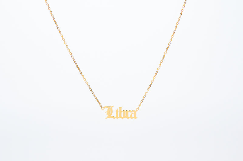 Zodiac Necklace in Old English Gothic Font. Choose from all signs of the Zodiac. Perfect for horoscope lovers. Crafted on our dainty cable chain. Made from stainless steel, choose from 18k Gold plated or Silver, tarnish free.